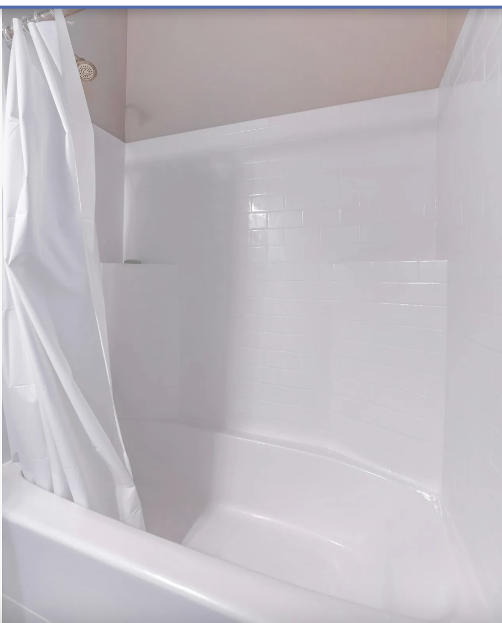 Freshly refinished bathtub and tile shower surround