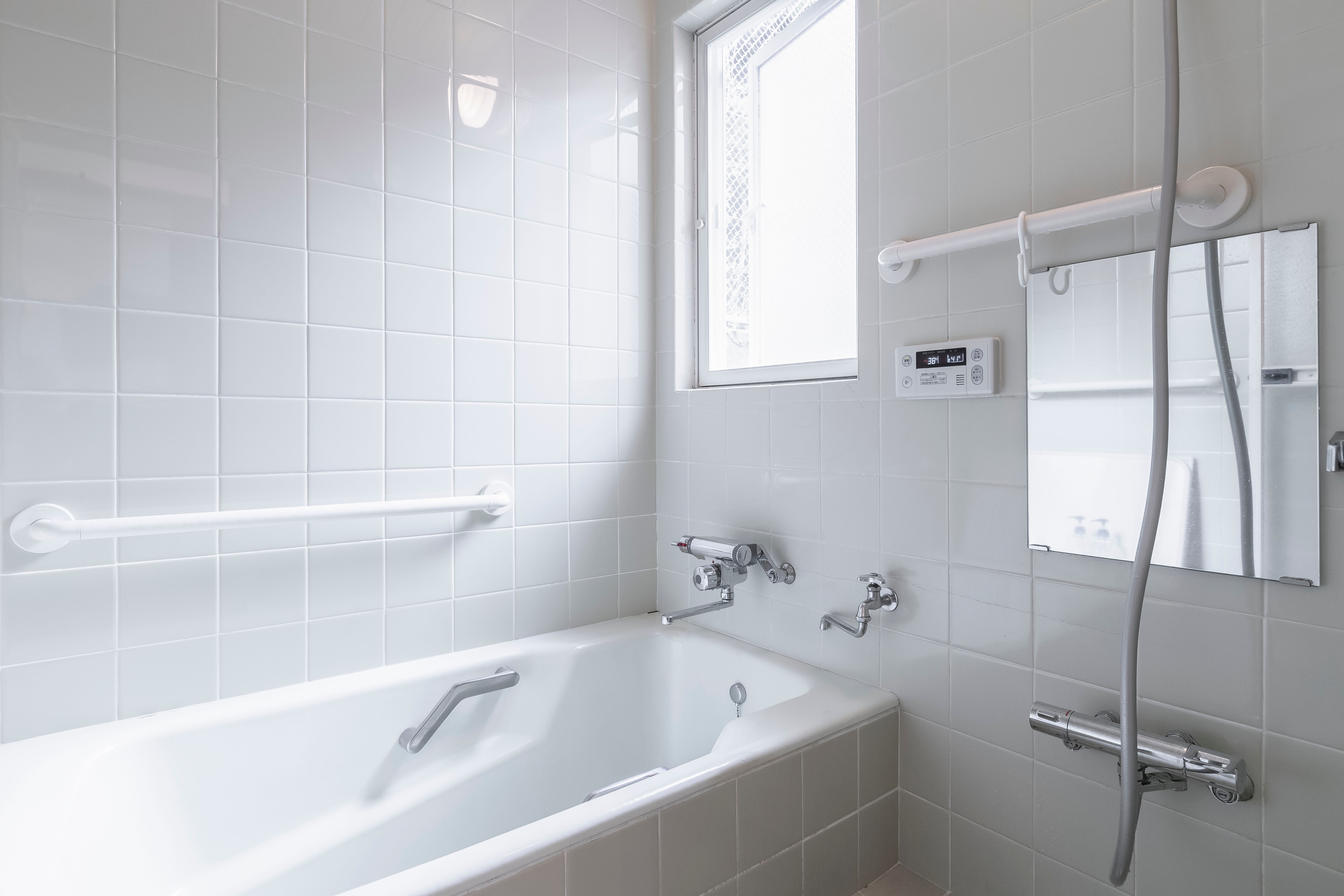 Non-slip bathtub with safety grab bars